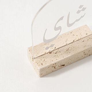 Dallaty Clear Acrylic Stand With Travertine Base White Text